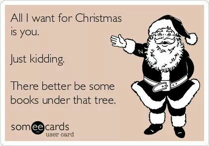 Meme Showing a Smiling Santa and the Text: All I Want for Christmas Is you. Just Kidding. There better be some books under that tree.