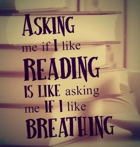 The words 'Asking me if I like reading is like asking me if I like breathing' superimposed on a picture of a stack of books